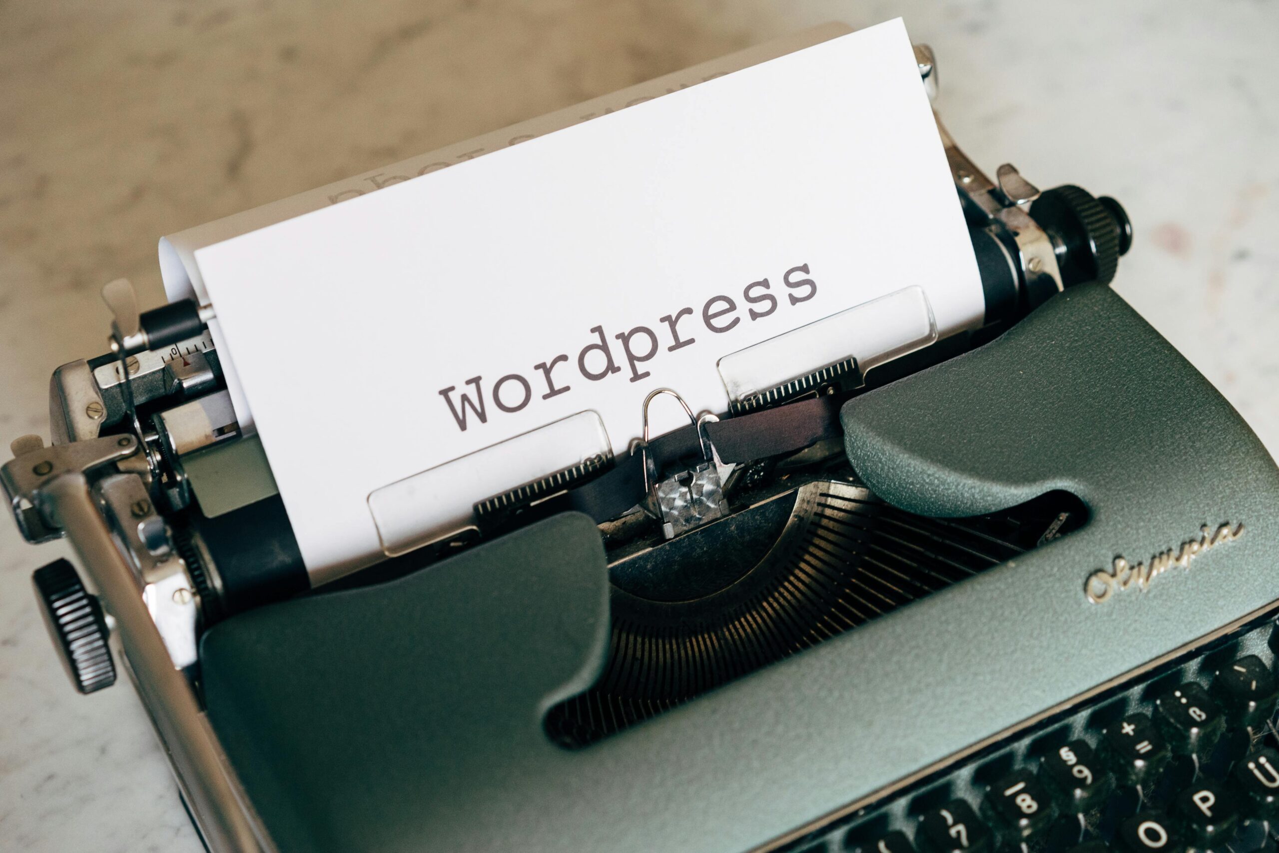 Typewriter with the word WordPress written on it